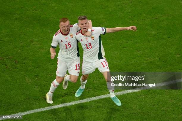 Andras Schaefer of Hungary celebrates with Laszlo Kleinheisler after scoring their side's second goal during the UEFA Euro 2020 Championship Group F...