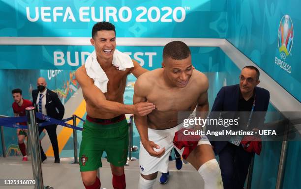 Cristiano Ronaldo of Portugal interacts with Kylian Mbappe of France in the tunnel following the UEFA Euro 2020 Championship Group F match between...