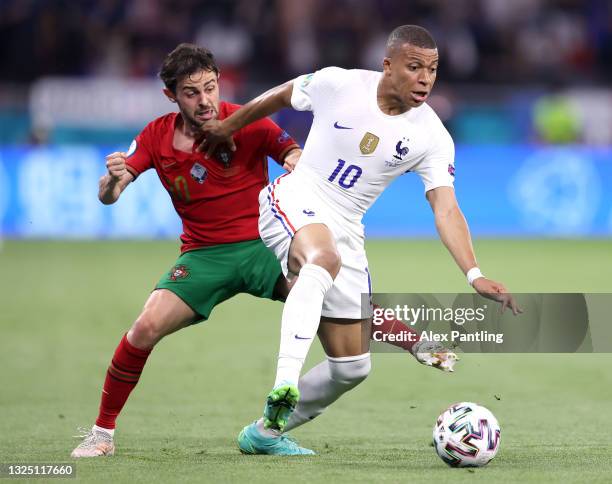 Kylian Mbappe of France is challenged by Bernardo Silva of Portugal during the UEFA Euro 2020 Championship Group F match between Portugal and France...