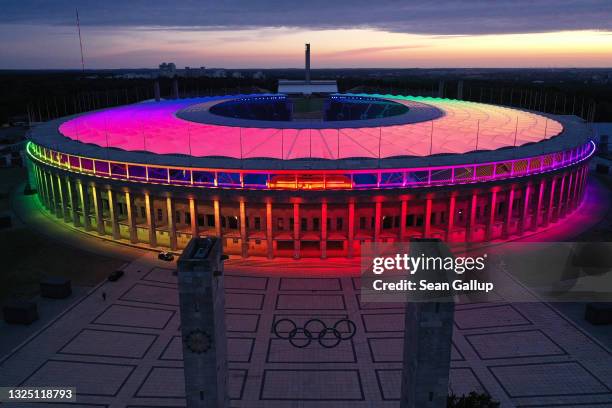 In this aerial view the Olympiastadion stadium stands illuminated in LGBT rainbow colors on June 23, 2021 in Berlin, Germany. Stadiums and landmarks...