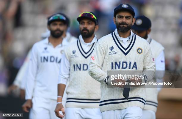 Virat Kohli leads his team including Ajikya Rahane and Ravindra Jadeja from the field after the ICC World Test Championship Final between India and...