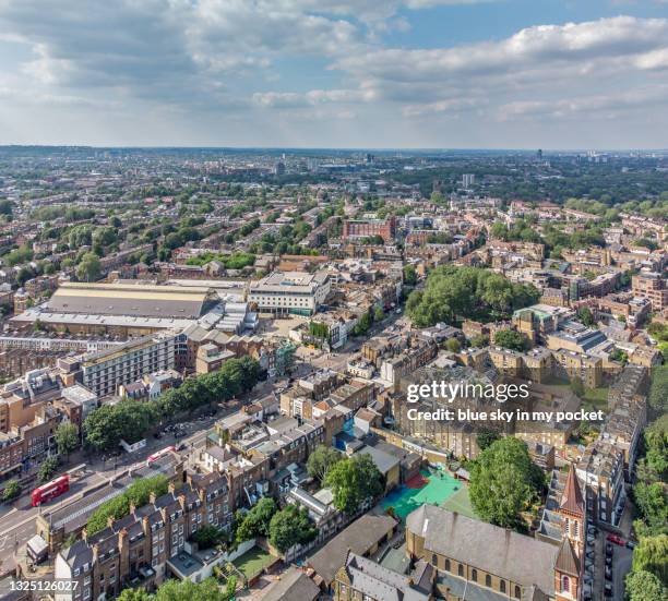 an aerial view over london, looking north over upper street islington, with the business design centre in the middle and islington green - islington stock pictures, royalty-free photos & images