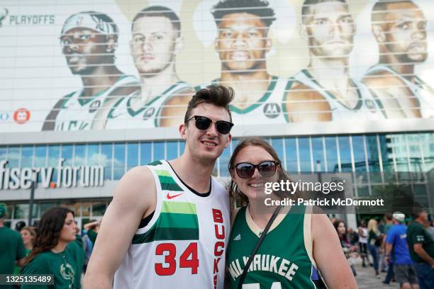 Milwaukee Bucks fans pose before entering game one of the Eastern Conference Finals against the Atlanta Hawks at Fiserv Forum on June 23, 2021 in...