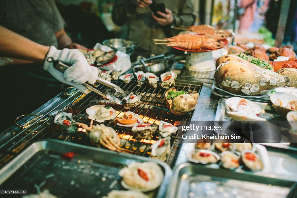 Street food selling barbecue Shellfish seafood