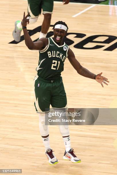 Jrue Holiday of the Milwaukee Bucks reacts to a three point shot against the Atlanta Hawks during the fourth quarter in game one of the Eastern...