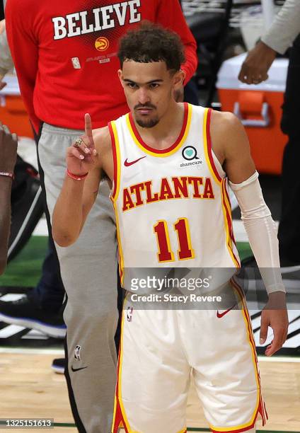 Trae Young of the Atlanta Hawks celebrates a win against the Milwaukee Bucks in game one of the Eastern Conference Finals at Fiserv Forum on June 23,...