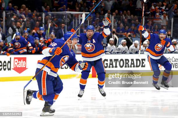 Anthony Beauvillier of the New York Islanders celebrates after scoring the game-winning goal during the first overtime period against the Tampa Bay...