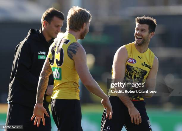 Nathan Broad speaks with Trent Cotchin of the Tigers during a Richmond Tigers AFL training session at Punt Road Oval on June 24, 2021 in Melbourne,...