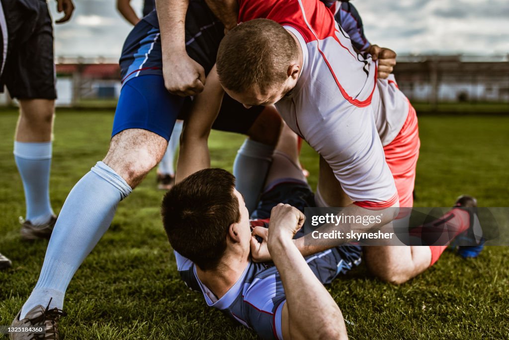 Field Fight Two Rivals Fist Fighting On Sports Match At Playing Field High-Res ...