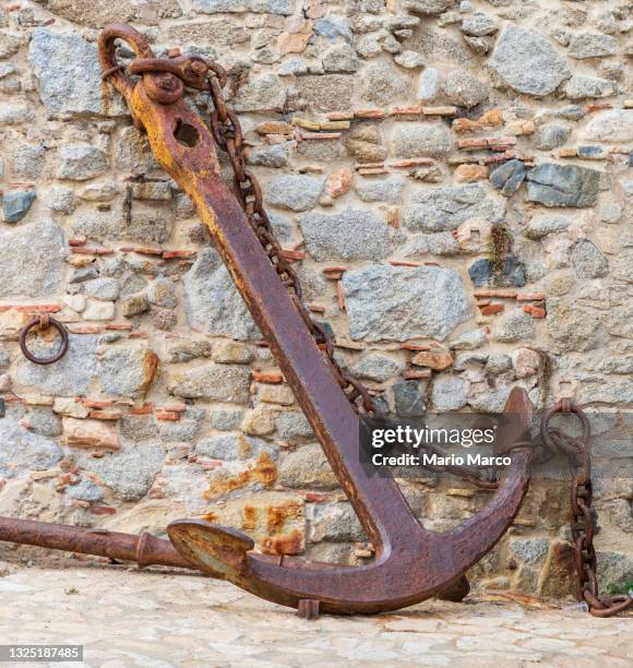 old and rusty sea anchor - rusty anchor stock pictures, royalty-free photos & images