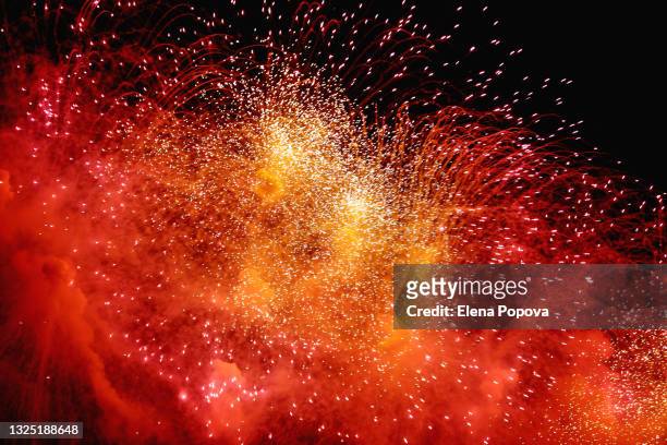 colourful fireworks display against dark night sky - fire explosion stock pictures, royalty-free photos & images