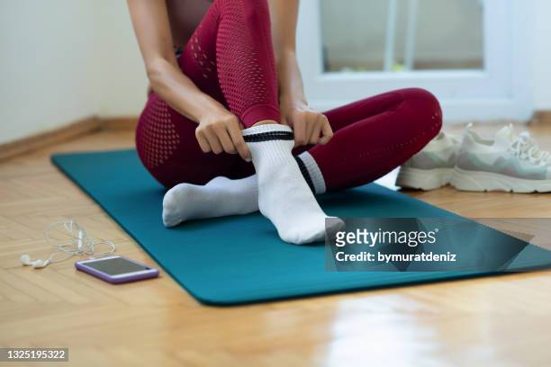 woman wearing white socks - sock stock pictures, royalty-free photos & images