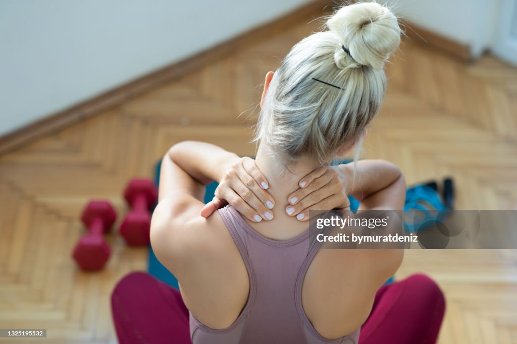 Woman rubbing her neck