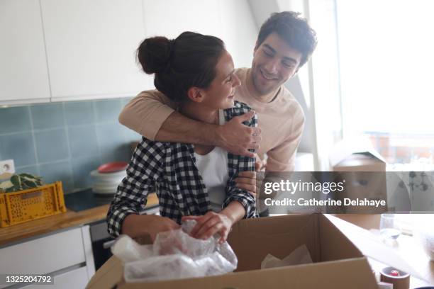 moving of a young couple - homeowner stock pictures, royalty-free photos & images
