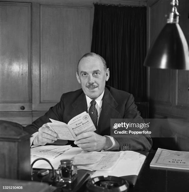 British businessman and politician Oliver Lyttelton , President of the Board of Trade in Winston Churchill's wartime coalition government, seated at...