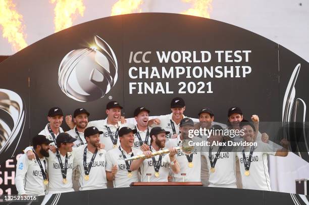 Kane Williamson of New Zealand lifts the ICC World Test Championship Mace with teammates after victory in the Reserve Day of the ICC World Test...