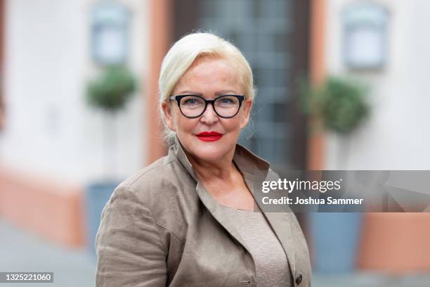 Angelika Milster poses during a photocall for the tv series "Unter Uns" at MMC Studios on June 24, 2021 in Cologne, Germany.