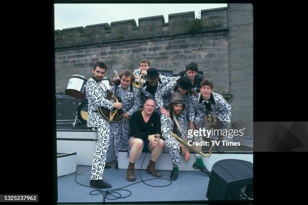 British ska group Bad Manners, including singer Buster Bloodvessel , photographed on stage before a live performance circa 1982.