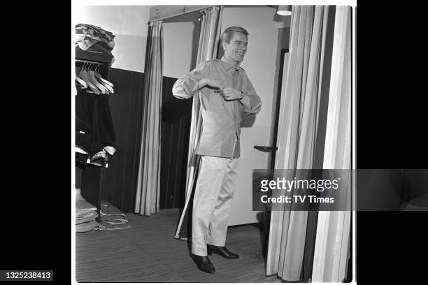 Singer and actor Adam Faith photographed in a dressing room, circa 1965.