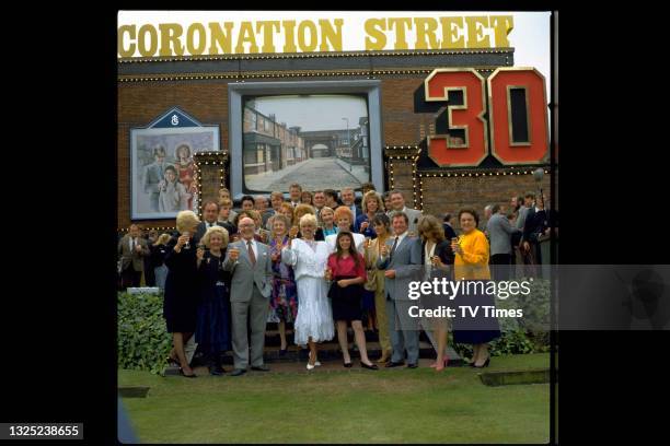 The cast of television soap Coronation Street photographed for the show's 30th anniversary, circa 1991.