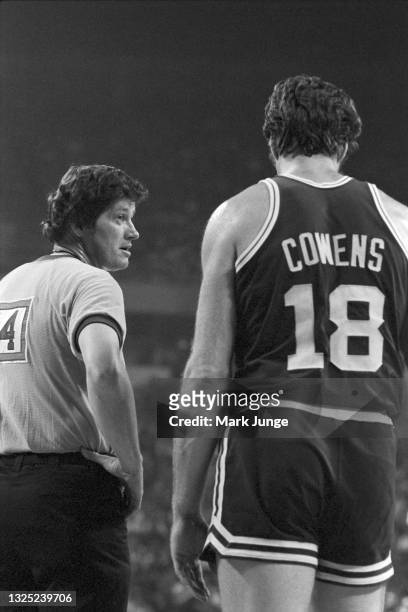 Referee Jack Madden waits for play to continue during an NBA basketball game between the Denver Nuggets and the Boston Celtics at McNichols Arena on...