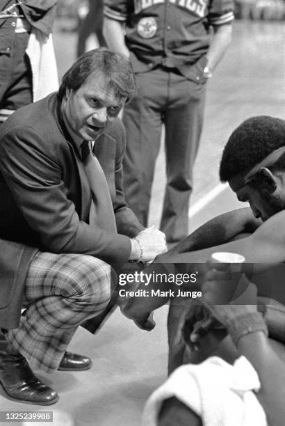 Boston Celtics Head Coach Tom Heinsohn admonishes his players during a game against the Denver Nuggets at McNichols Arena on February 27, 1977 in...
