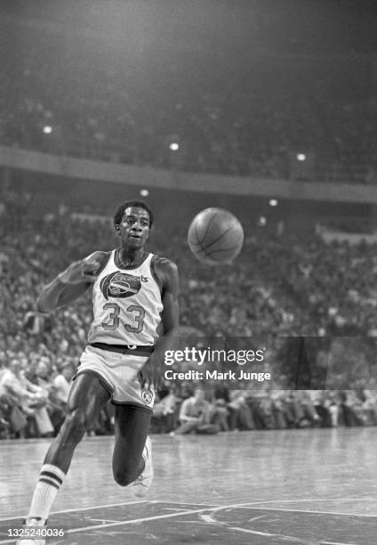 Denver Nuggets forward David Thompson chases the ball during a game against the Boston Celtics at McNichols Arena on February 27, 1977 in Denver,...