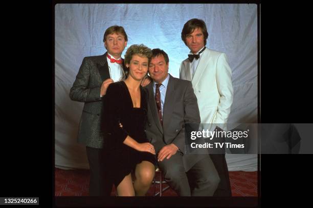 Hywel Bennett, Amanda Burton, Michael Elphick and Oliver Tobias in character for 'Charity Begins At Home', a two-part episode of the comedy drama...