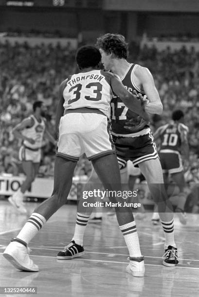 Boston Celtics forward John Havlicek blocks Denver Nuggets forward David Thompson during an NBA basketball game at McNichols Arena on February 27,...