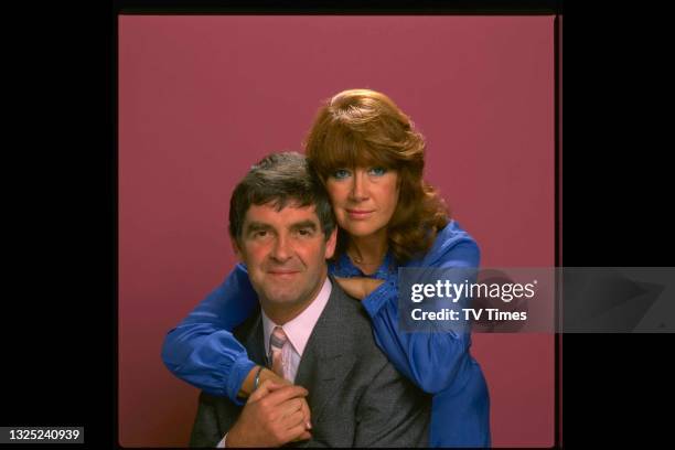 Actors Derek Nimmo and Nerys Hughes in character as George Hutchenson and Beth Jenkins in sitcom Third Time Lucky, circa 1982.