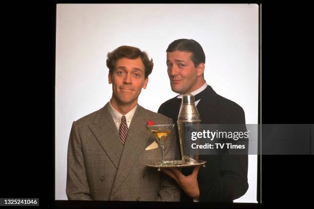 Comic actors Hugh Laurie and Stephen Fry in character as Bertie Wooster and Reginald Jeeves in the period comedy Jeeves And Wooster, circa 1990.