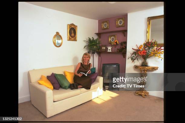 Television presenter Esther McVey photographed at home, circa 1997.