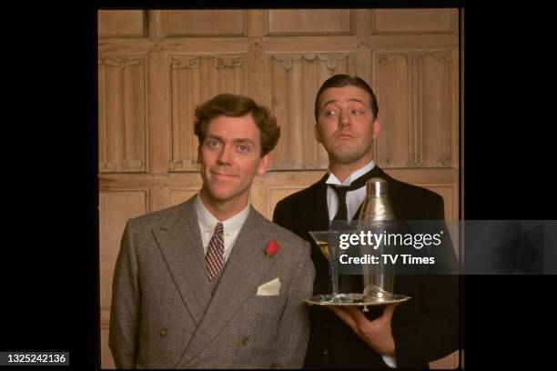 Comic actors Hugh Laurie and Stephen Fry in character as Bertie Wooster and Reginald Jeeves in the period comedy Jeeves And Wooster, circa 1990.