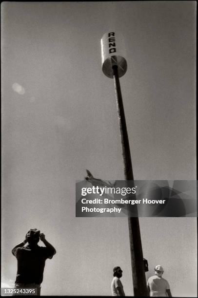 View of a plane in flight as it rounds a pylon during an event in the National Championship Air Races at the Reno Stead Airport, Reno, Nevada,...