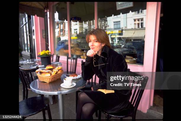 Actress Jemma Redgrave sitting outside a cafe in London, circa 1996.