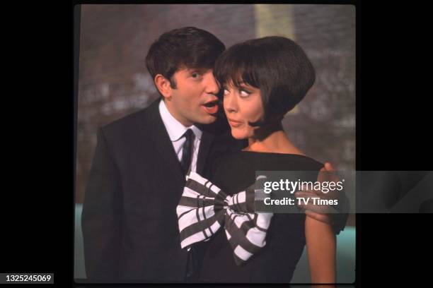 Comedian Jimmy Tarbuck and actress Amanda Barrie, likely on the set of light entertainment series It's Tarbuck, circa 1965.