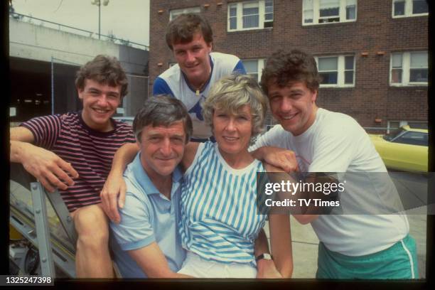 Television presenter Michael Parkinson photographed with his wife Mary and their children, circa 1983.