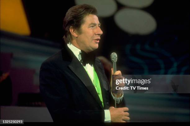 Entertainer Max Bygraves performing on set, circa 1974.