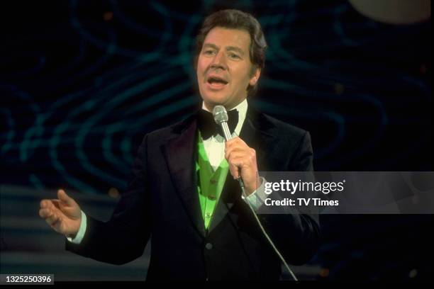 Entertainer Max Bygraves performing on set, circa 1974.