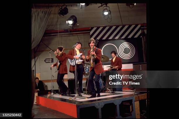 Ray Davies, Pete Quaife, Dave Davies and Mick Avory of English rock group The Kinks performing on music programme Ready Steady Go! in London, circa...