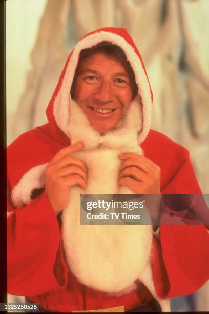 Entertainer Max Bygraves dressed as Santa Claus, circa 1977.