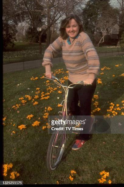 Actress Pauline Quirke photographed riding a bicycle, circa 1976.
