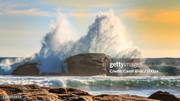 scenic view of waves splashing on rocks against sky,margaret river,western australia,australia - margaret river australia stock pictures, royalty-free photos & images