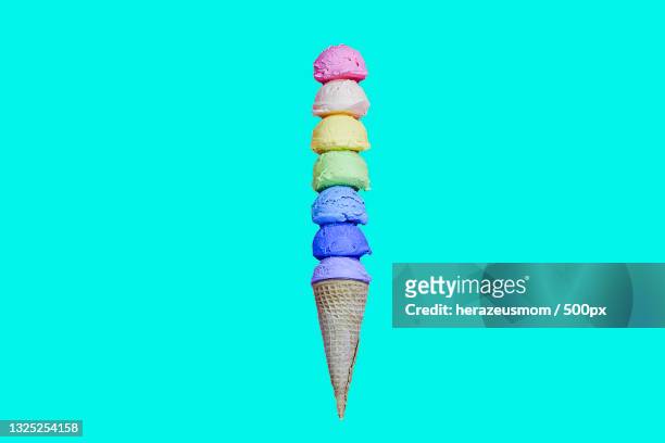 close-up of ice cream cone against blue background,united states,usa - ice cream cone stockfoto's en -beelden
