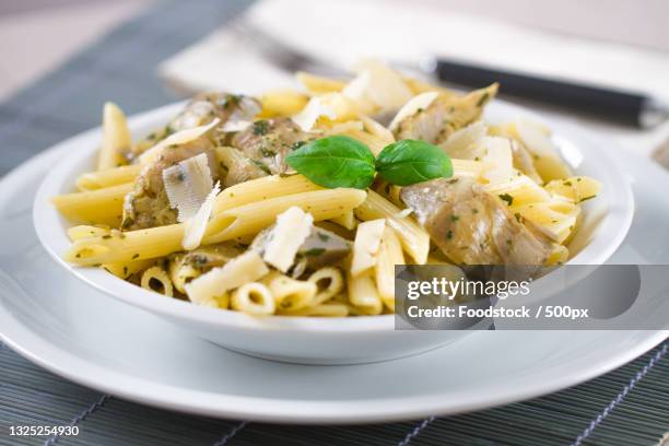 close-up of pasta in plate on table - penne stock pictures, royalty-free photos & images