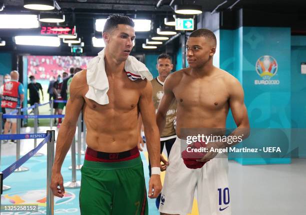 Cristiano Ronaldo of Portugal speaks with Kylian Mbappe of France in the tunnel following the UEFA Euro 2020 Championship Group F match between...