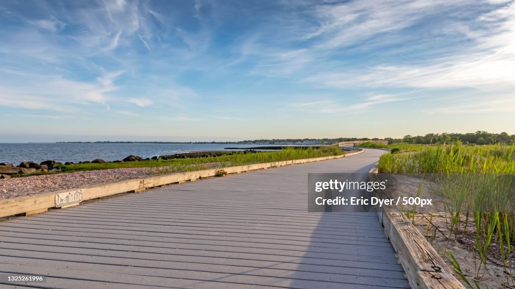 Empty footpath by sea against sky,Stratford,Connecticut,United States,USA