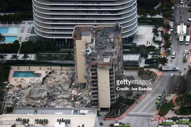 In this aerial view, search and rescue personnel work after the partial collapse of the 12-story Champlain Towers South condo building on June 24,...