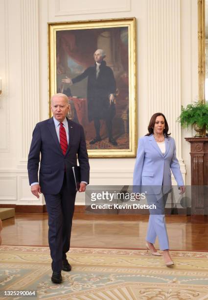 President Joe Biden talks to Vice President Kamala Harris after delivering remarks on the Senate's bipartisan infrastructure deal at the White House...