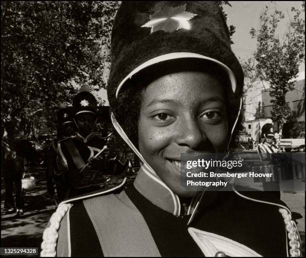 Close-up of an unidentified high school drum major as she smiles during a parade, Los Angeles, California, 1979.